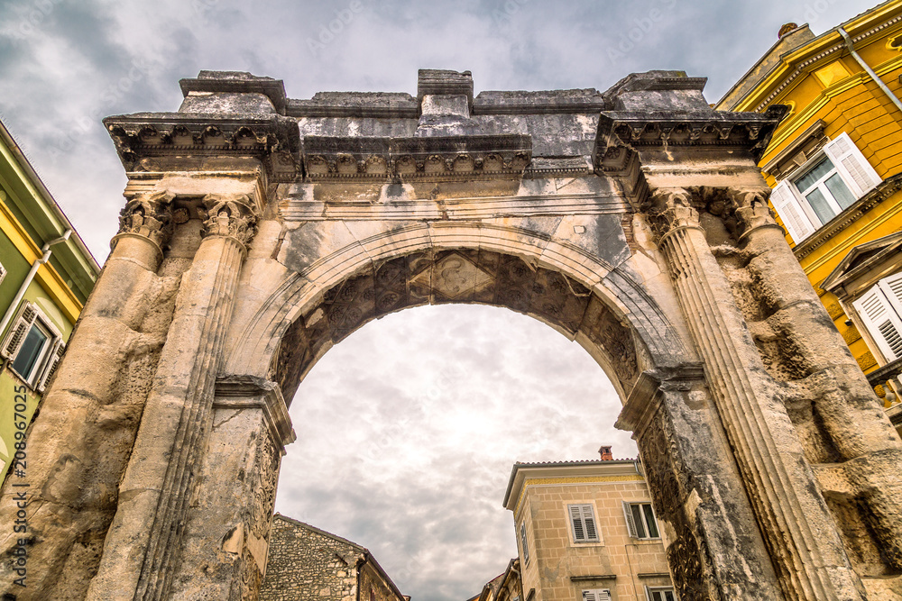 Ancient Roman triumphal Arch of the Sergii in Pula, Croatia, Europe.