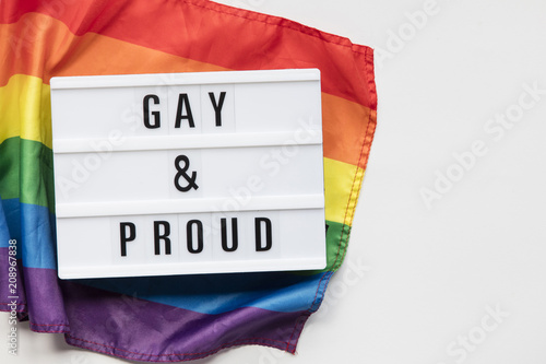 Gay and Proud lightbox message on an LGBT gay pride flag