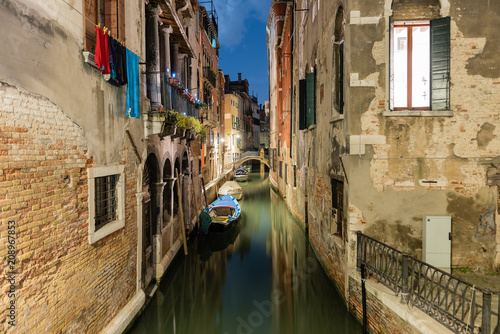 View over a picturesque canal at night, Venice, Italy © marcorubino