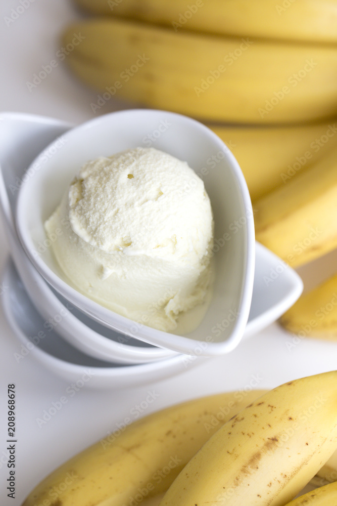 delicious ice cream  and bananas on a white background