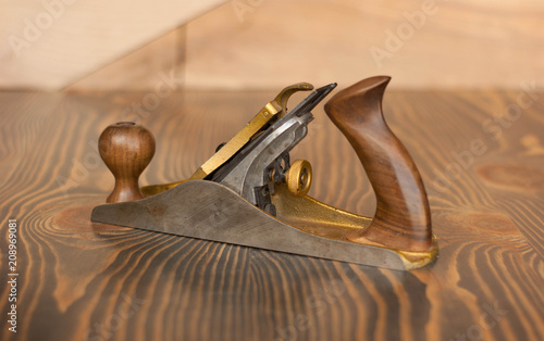 Vintage steel jointer on a wooden background