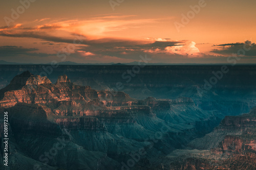landscape of Grand Canyon with orange sky during sunset in Arizona, USA.