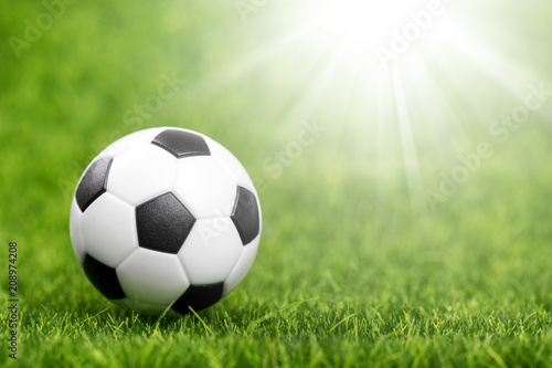 Soccer ball on green grass © photopixel