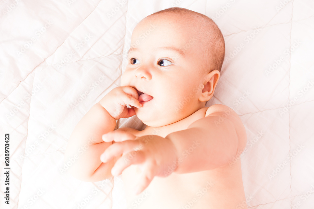 Toddler with a finger in the mouth