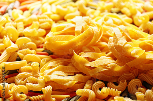 Tagliatelle nests and color pasta close up macro