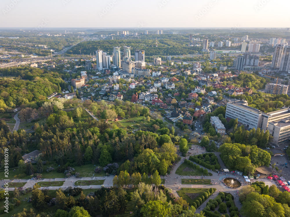 A bird's eye view, panoramic view from the drone to the view of the central alley of the Botanical Garden and the construction of the Pechersk district in the city of Kiev, Ukraine