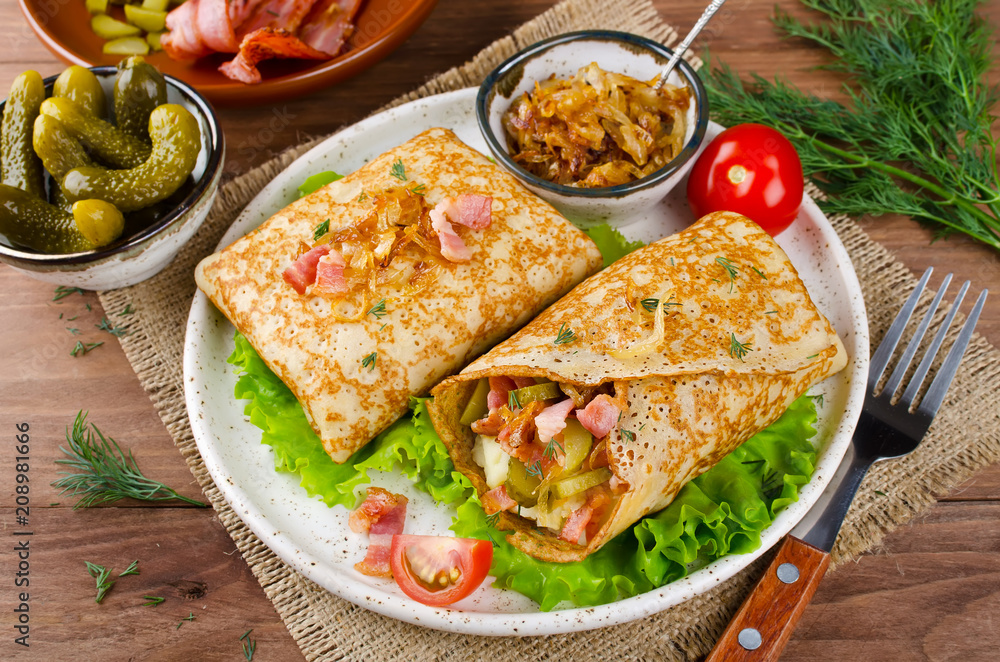 Savory pancakes stuffed with mashed potatoes, pickles and bacon Savory pancakes stuffed with mashed potatoes, pickles and bacon