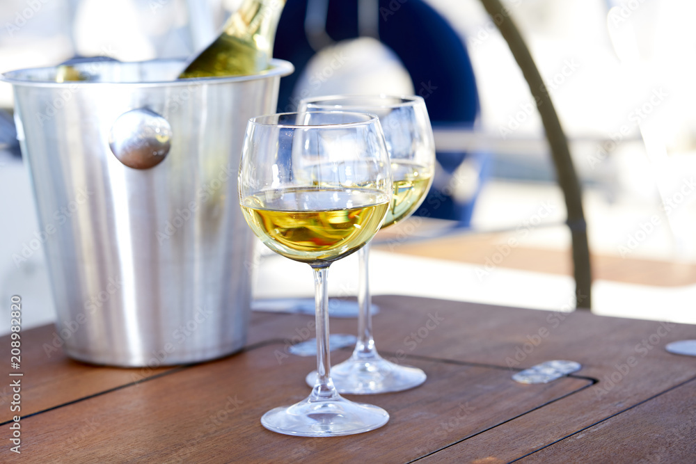 Pair of wineglasses against the yacht Pair of wineglasses against the yacht