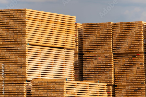Stacks of wooden beams  storaged wood.