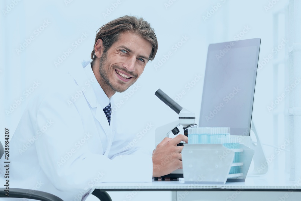 Male Chemist Scientific Reseacher using Microscope in Laboratory Male Chemist Scientific Reseacher using Microscope in Laboratory