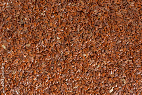 Many raw flax seeds, wholesome ingredient used in cooking.