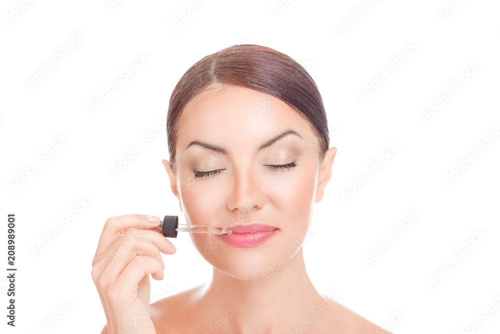 girl applying serum essence essential oils to her lips for moisture girl applying serum essence essential oils to her lips for moisture