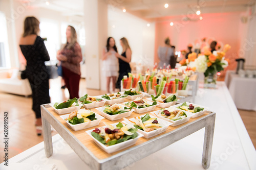 Healthy organic gluten-free delicious green snacks salads on catering table during corporate event party
