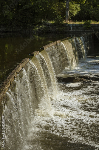 Water cascading down small waterfall on Blackstone River