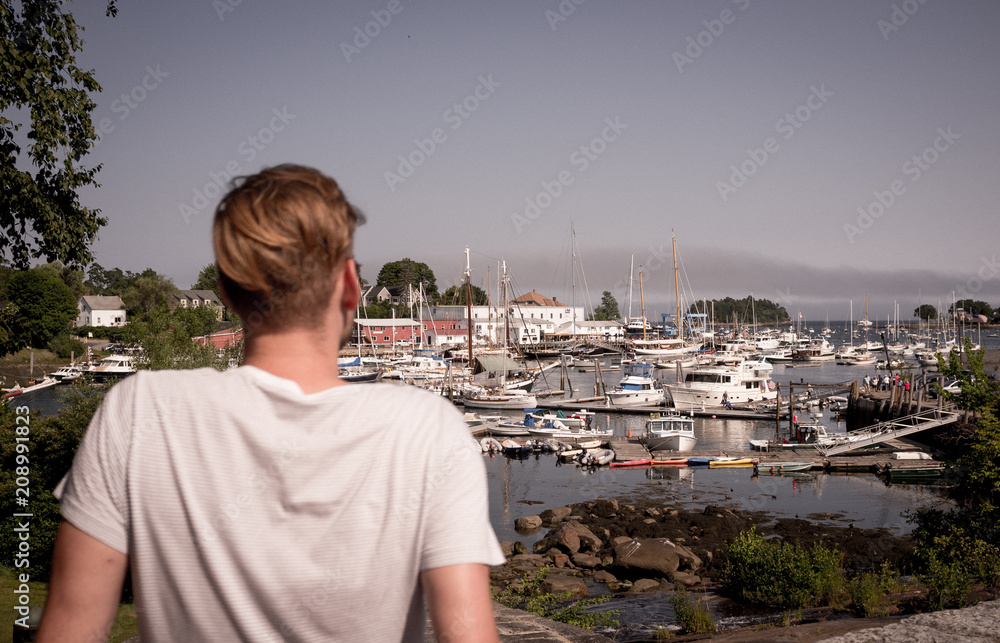 Man overlooking Camden, Maine harbor