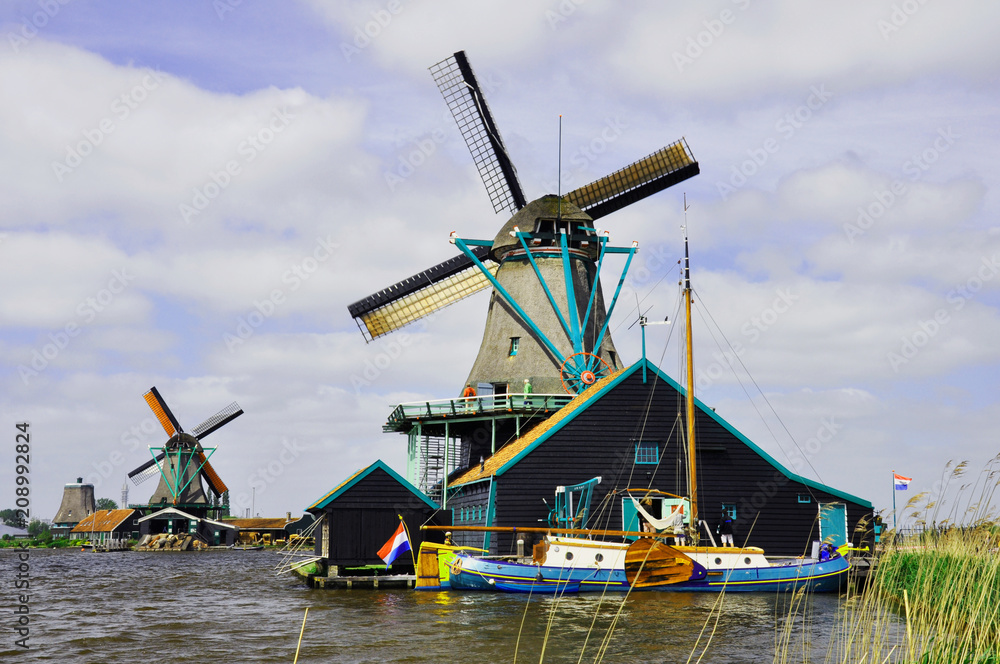 Fototapeta premium Valley of the picturesque wooden windmills in Zaanse Schans, the Netherlands.