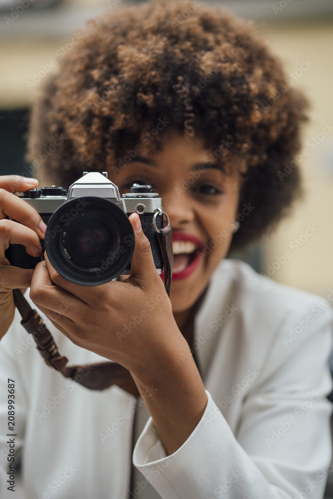 Female Photographer Holding an Old Analog Camera Female Photographer Holding an Old Analog Camera