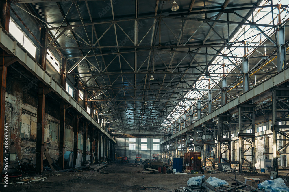 Ruined industrial hall of warehouse or hangar in process of reconstruction Ruined industrial hall of warehouse or hangar in process of reconstruction