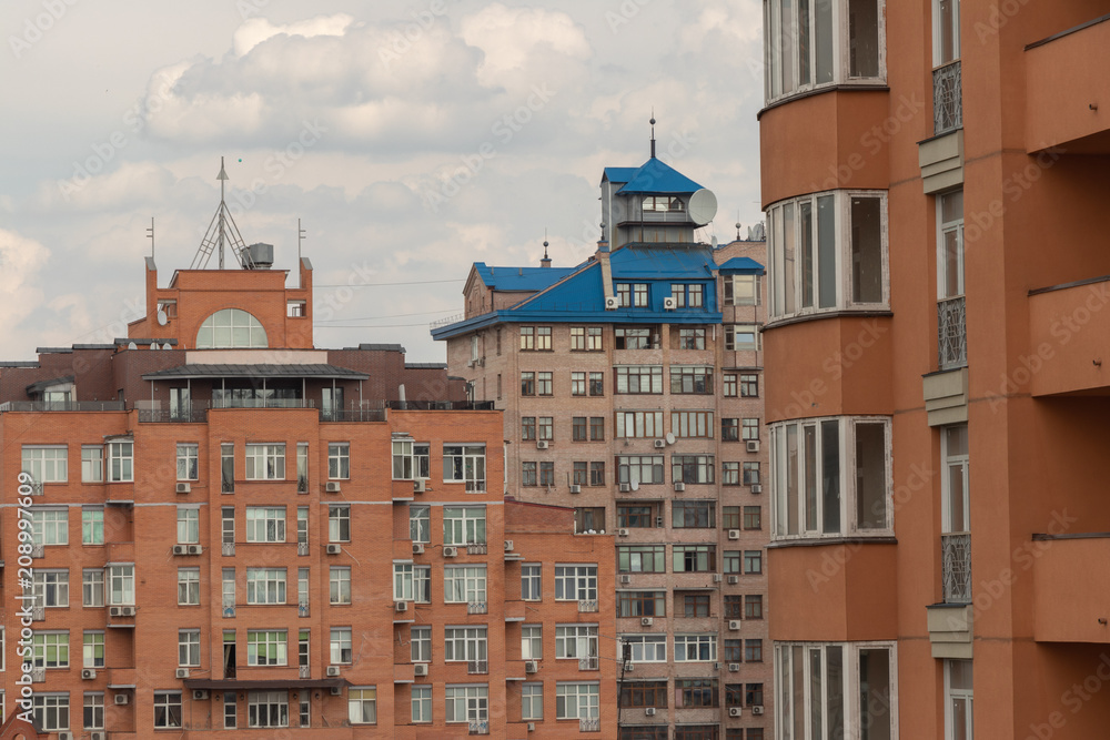 high brick buildings with a blue roof