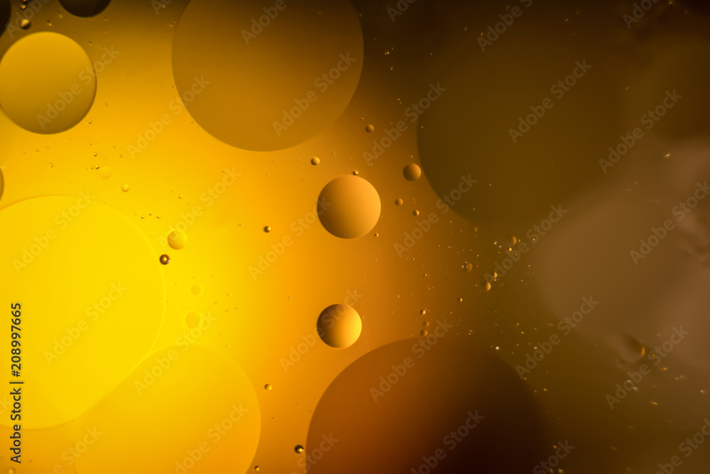 the interaction of water and oil, oil bubbles of various sizes on the water surface, colorful abstract macro background the interaction of water and oil, oil bubbles of various sizes on the water surface, colorful abstract macro background