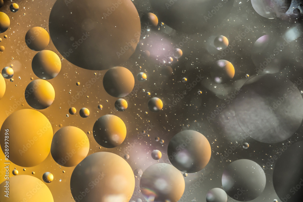 the interaction of water and oil, oil bubbles of various sizes on the water surface, colorful abstract macro background the interaction of water and oil, oil bubbles of various sizes on the water surface, colorful abstract macro background