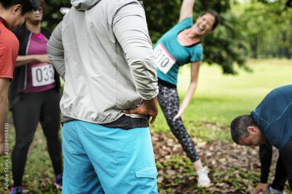 Group of diverse athlete are stretching their muscle Group of diverse athlete are stretching their muscle