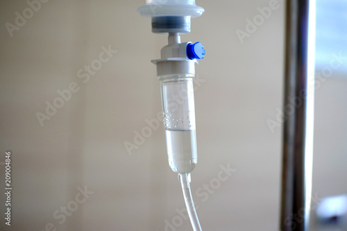 The saline drop form bottle drip down to tube. In hospital.