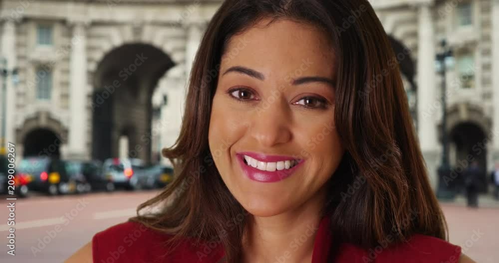 Close up portrait of cheerful smiling Latina female in London, Healthy attractive young woman with bright smile looking at camera, 4k