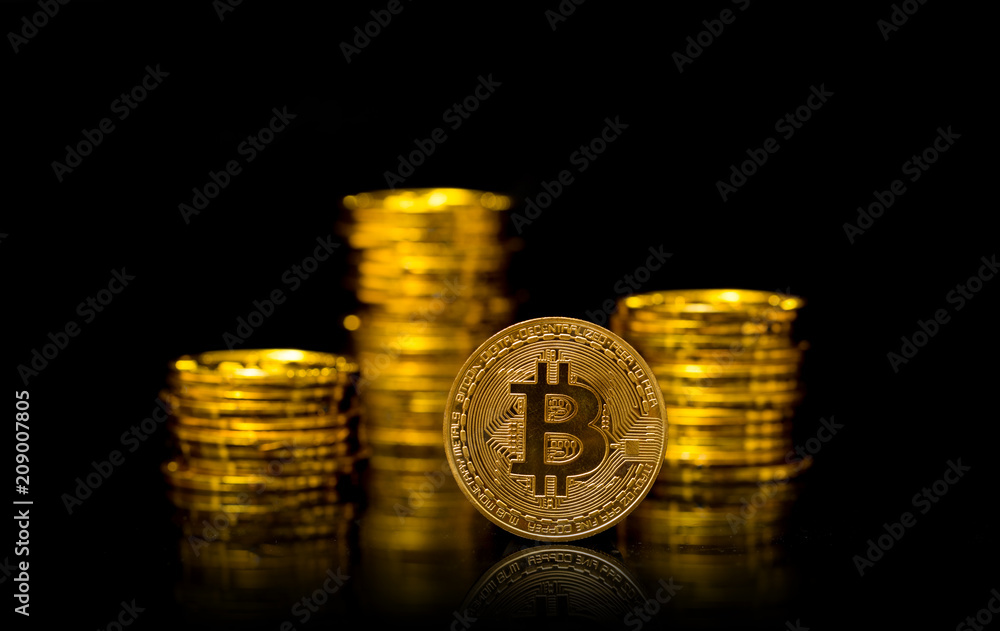 Physical Bitcoin isolated on black background, Digital currency concept Physical Bitcoin isolated on black background, Digital currency concept