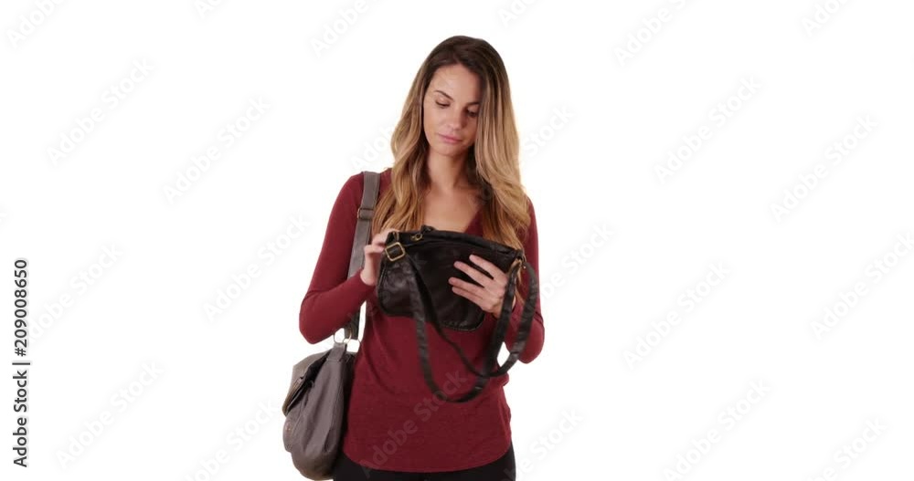 Happy and attractive female shopper looking at purse in studio, Portrait of stylish woman shopping on white background with copyspace, 4k Happy and attractive female shopper looking at purse in studio, Portrait of stylish woman shopping on white background with copyspace, 4k