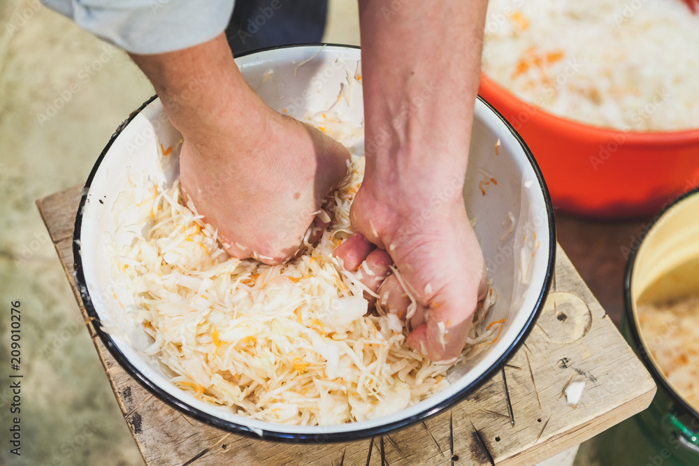 We prepare sauerkraut with our own hands