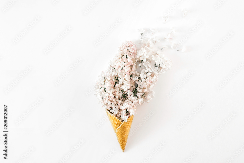 Top view ice cream cone branch white lilacs. Minimal spring concept Flat lay Top view ice cream cone branch white lilacs. Minimal spring concept Flat lay
