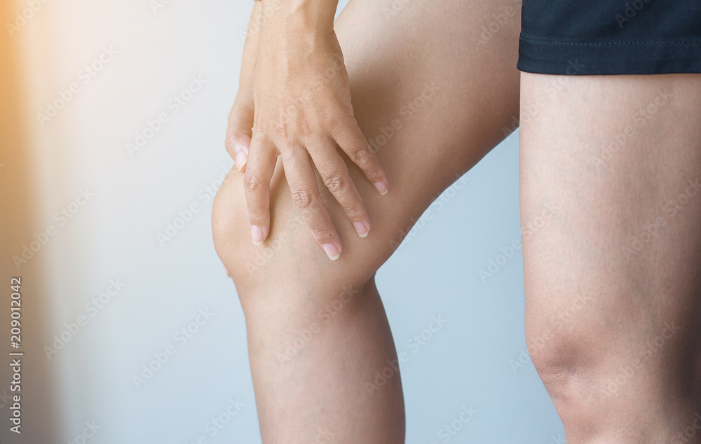 Woman having knee pain,Female feeling exhausted and painful,Close up