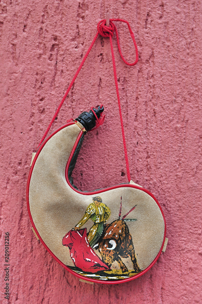 Bullfighter bota bag or wineskin is a traditional Spanish leather liquid receptacle canteen Stock Foto Adobe Stock