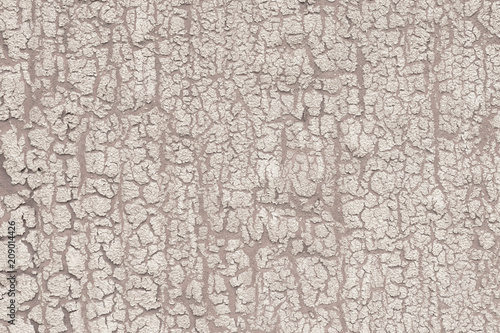 Cracked paint on wall with texture.