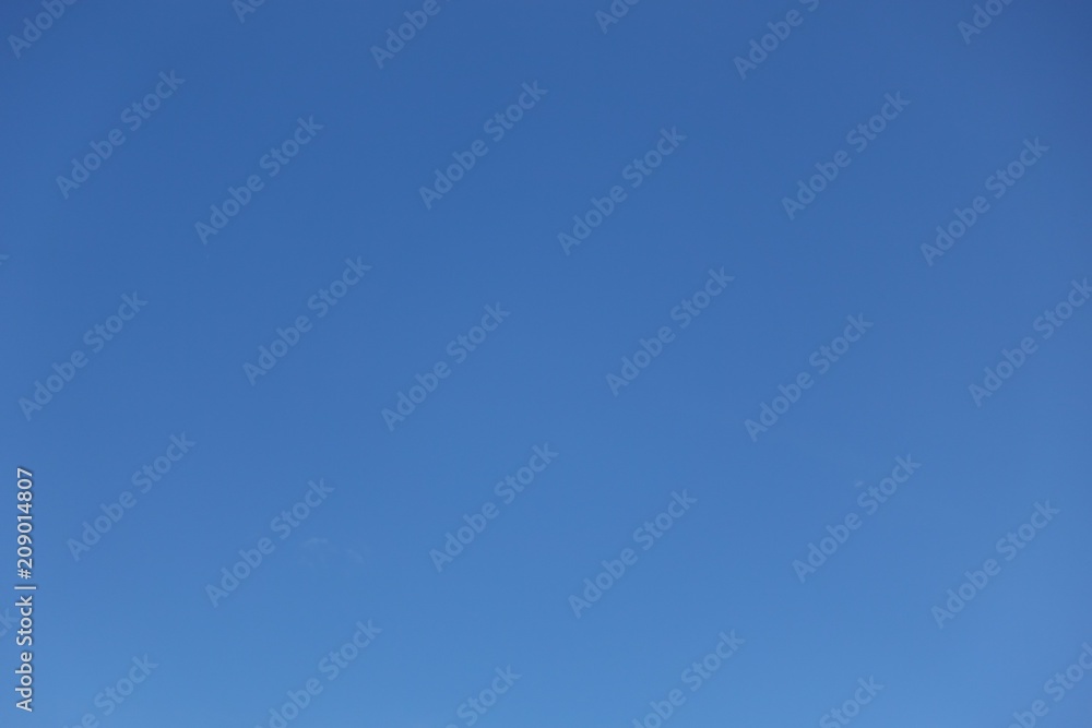 Sky, clear blue sky background with clouds and space in the middle. Sky, clear blue sky background with clouds and space in the middle.