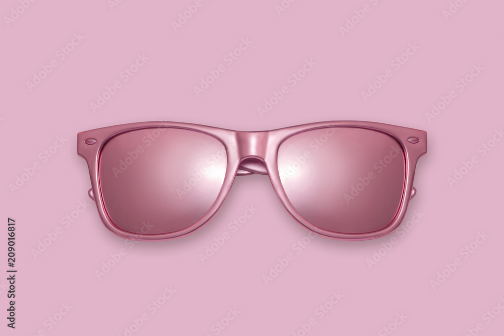 Golden sun glasses on a pink background. Creative concept, contemporary art Golden sun glasses on a pink background. Creative concept, contemporary art