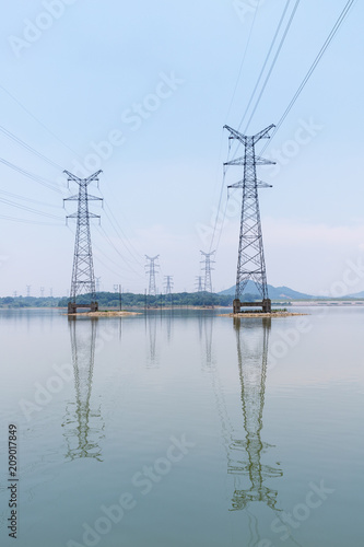 electricity pylon on lake