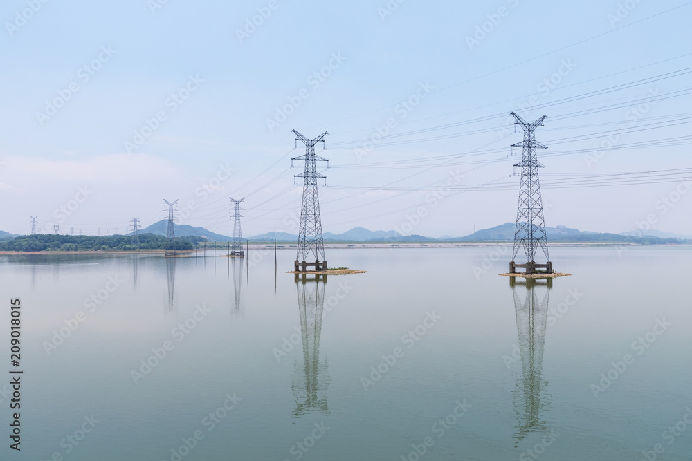 electricity pylon on lake