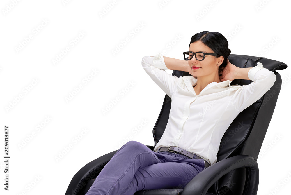 Young woman sitting on relaxing massage armchair
