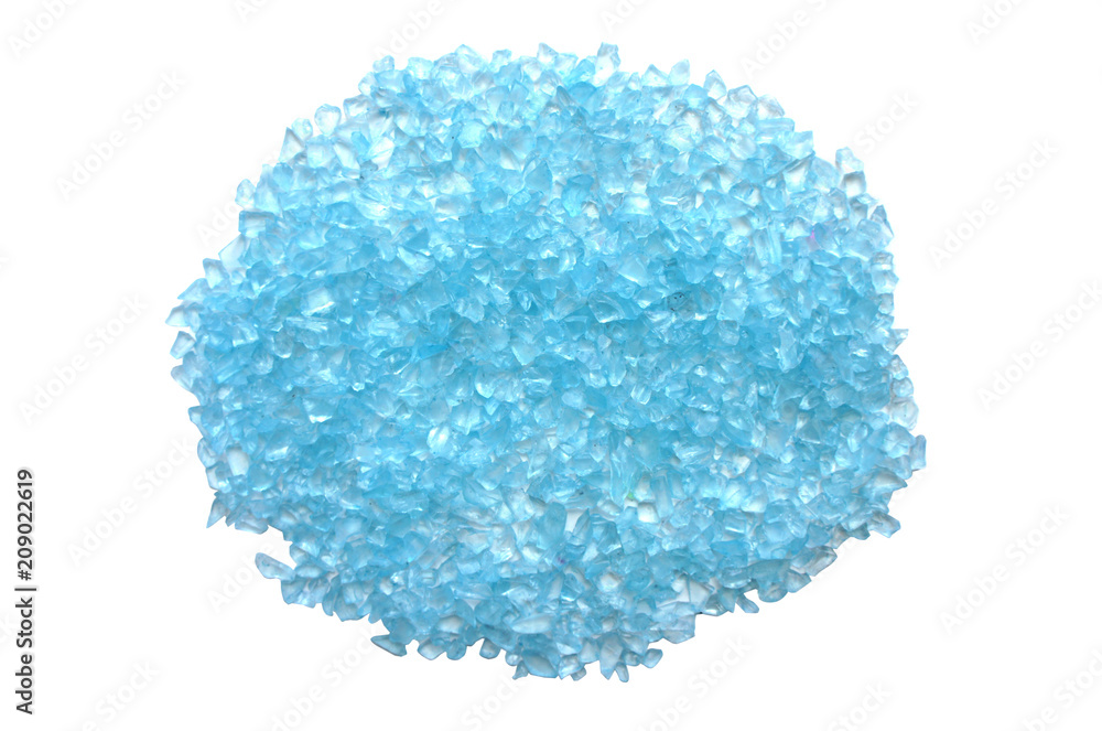 A handful of sea salt isolated on a white background. Blue. A handful of sea salt isolated on a white background. Blue.