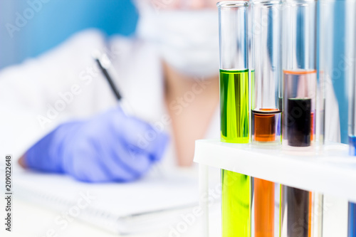 Test tube with toxic color liquid water in laboratory.