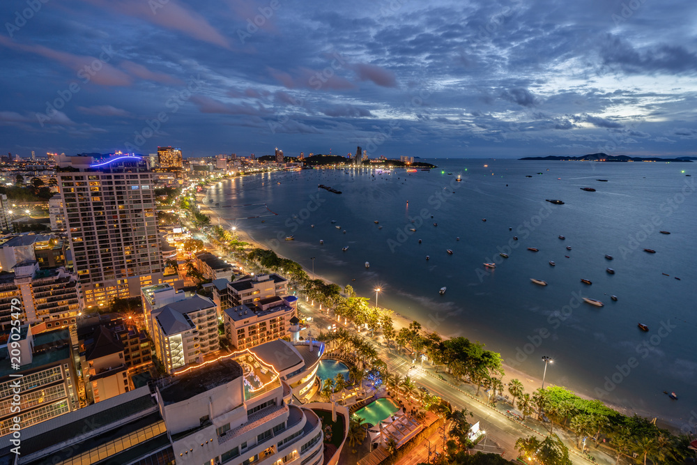 Naklejka premium Aerial View of Pattaya City and Beach at Twilight Sunset, Chonburi, Thailand. One of Most Popular Tourist Attraction in Thailand.
