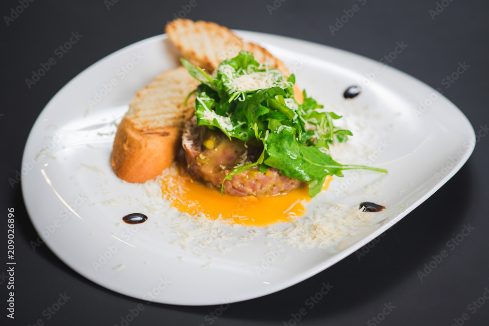 Dish with meat and croutons with sauce Dish with meat and croutons with sauce