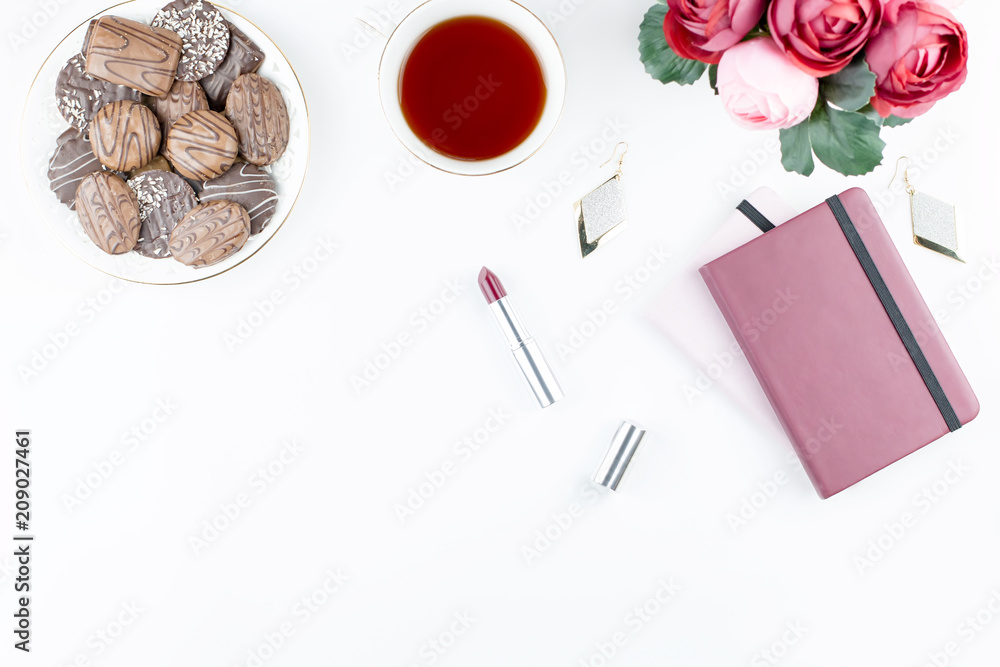 Flat lay home office desk. Feminine workspace with diary, flowers, sweets, fashion accessories. Fashion blogger concept. Flat lay home office desk. Feminine workspace with diary, flowers, sweets, fashion accessories. Fashion blogger concept.