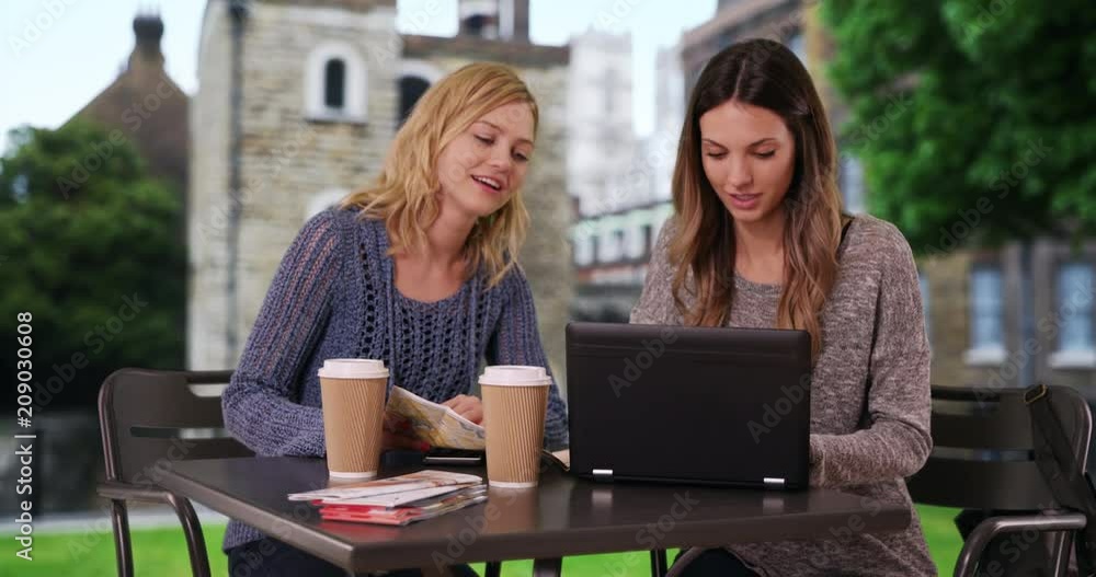 Pretty caucasian tourist looking at travel maps and using portable tech devices in Westminster, London, Lovely young women sitting and looking at maps in residential area of Westminster, 4k Pretty caucasian tourist looking at travel maps and using portable tech devices in Westminster, London, Lovely young women sitting and looking at maps in residential area of Westminster, 4k