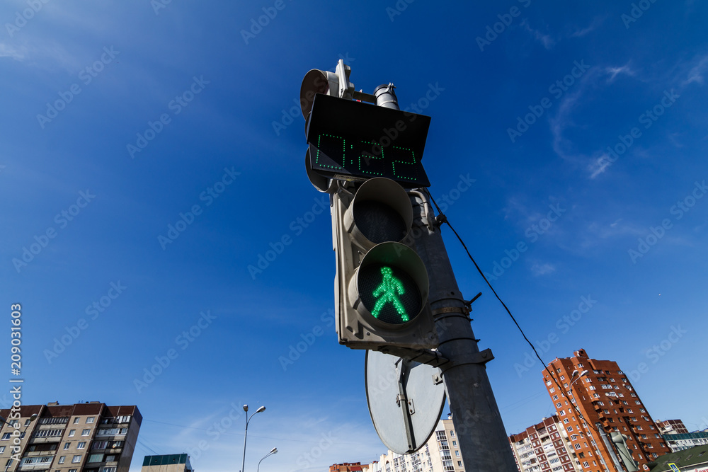 green pedestrian traffic light sign