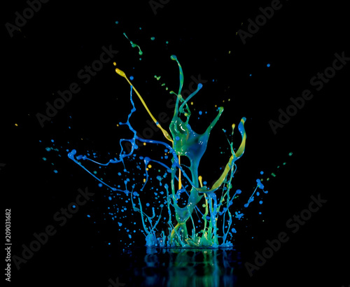 Splash of color ink on black background