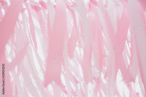 Texture of coral pink and white ribbon decorated .Pastel color tone pattern background.