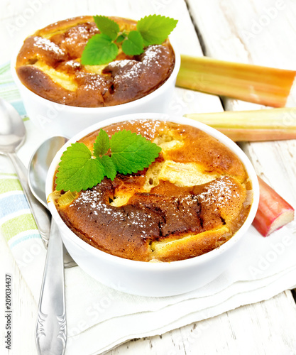 Klafuti with rhubarb in bowl on wooden table photo